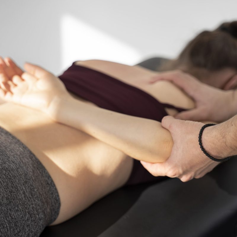 physiotherapist-helping-patient-recover-close-up